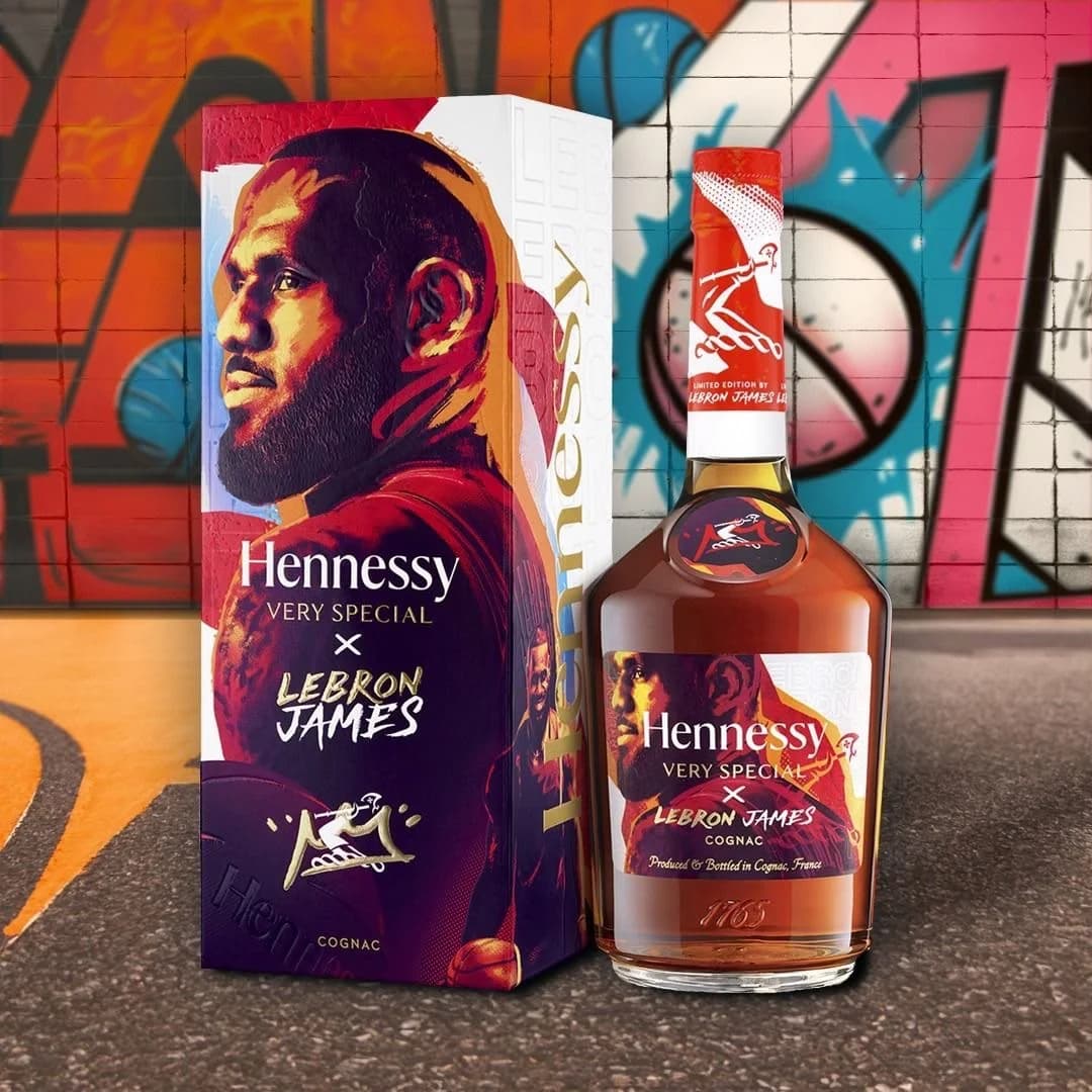 Hennessy V.S × LeBron James bottle and gift box against a graffiti wall