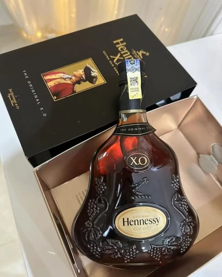 Hennessy X.O lying in its gold-lined gift box